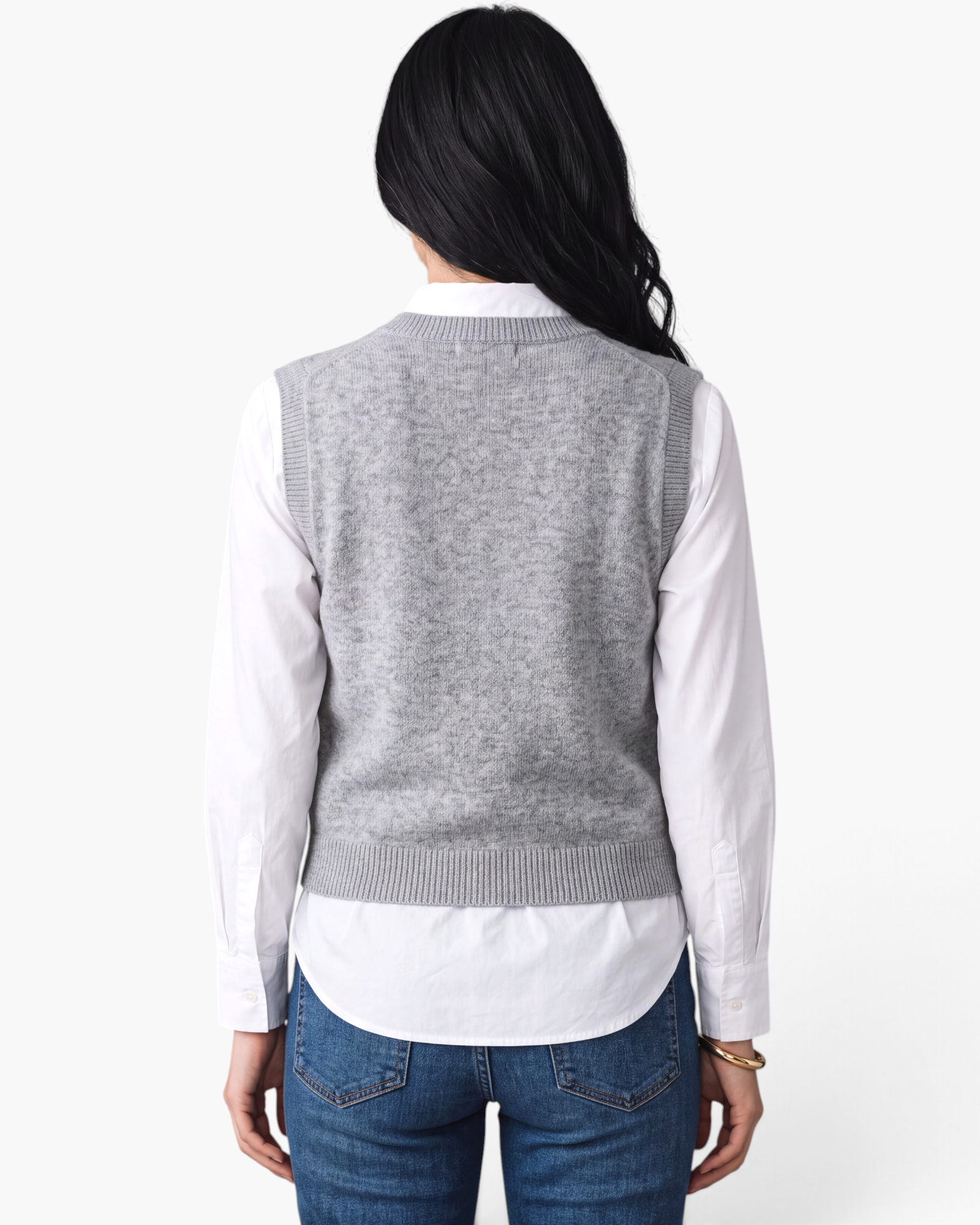 Back view of a model wearing a Beach Rose Co. heather gray knit sweater vest layered over a white collared shirt.