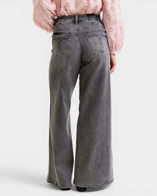 Beach Rose Co. Gray wash wide leg jeans with mid-rise waist and pockets. Made from cotton blend.