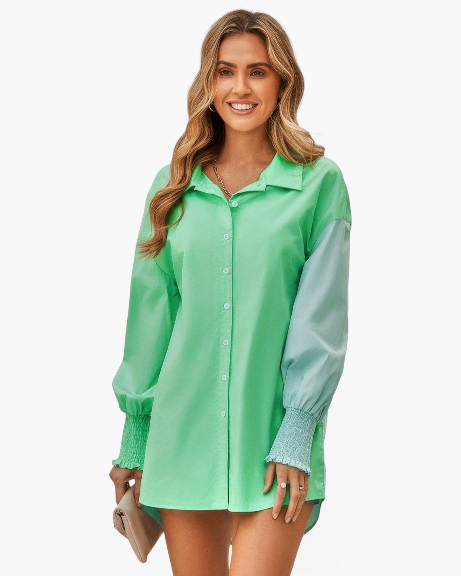 Beach Rose Co. green color block button down blouse with long cuffed sleeves worn by a smiling woman