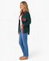 Beach Rose Co. forest green corduroy shacket with red plaid accents worn by a woman with jeans and tan loafers