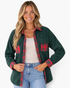 Beach Rose Co. forest green corduroy shacket with red plaid collar, cuffs, and chest pockets on a smiling model.