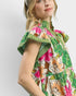 Beach Rose Co. green floral midi dress with split neckline, stand collar, flutter sleeves, and tiered silhouette. Rayon/nylon blend.