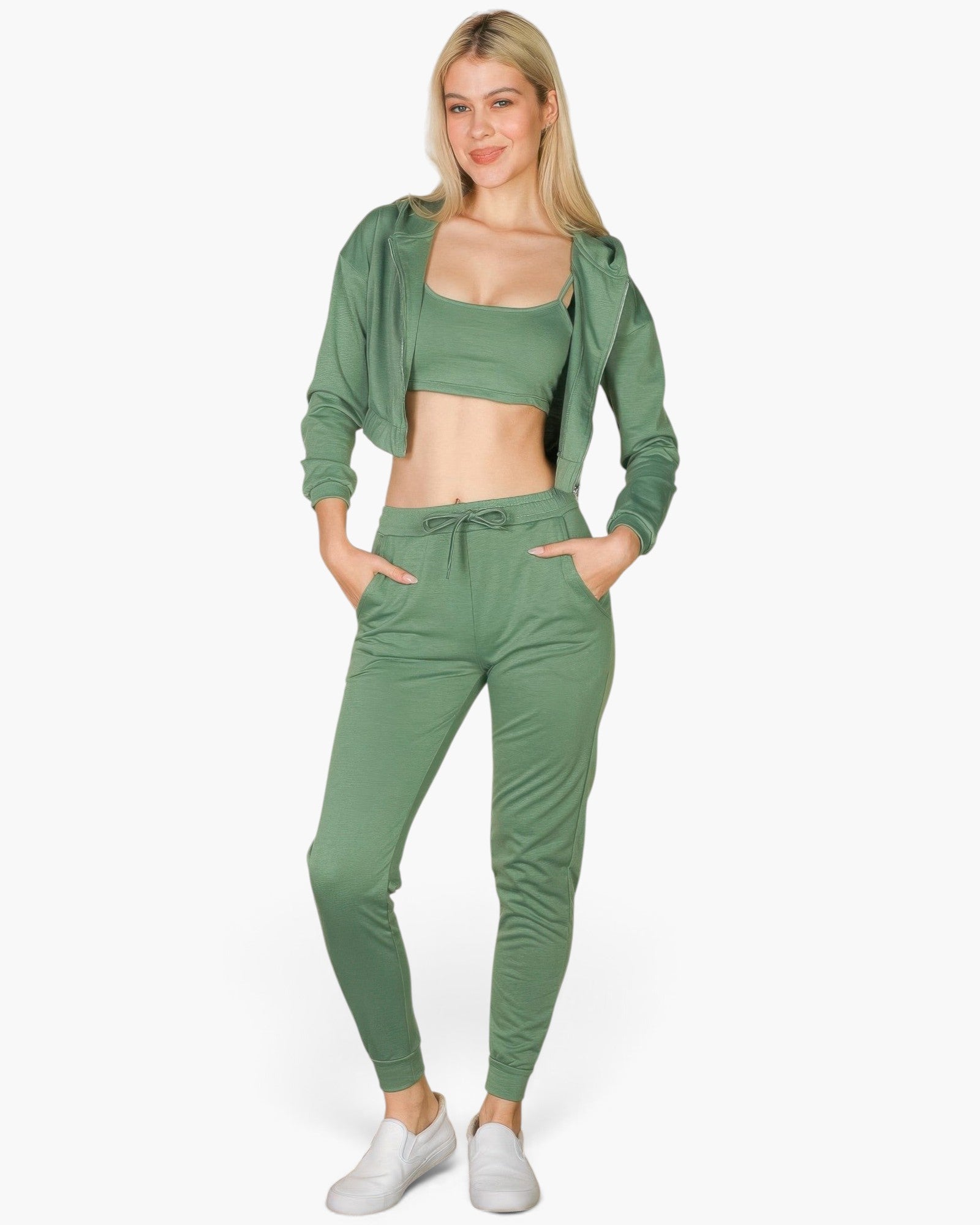 Beach Rose Co. green French terry three-piece set with cropped cami, zip-up jacket, and joggers on a blonde model.