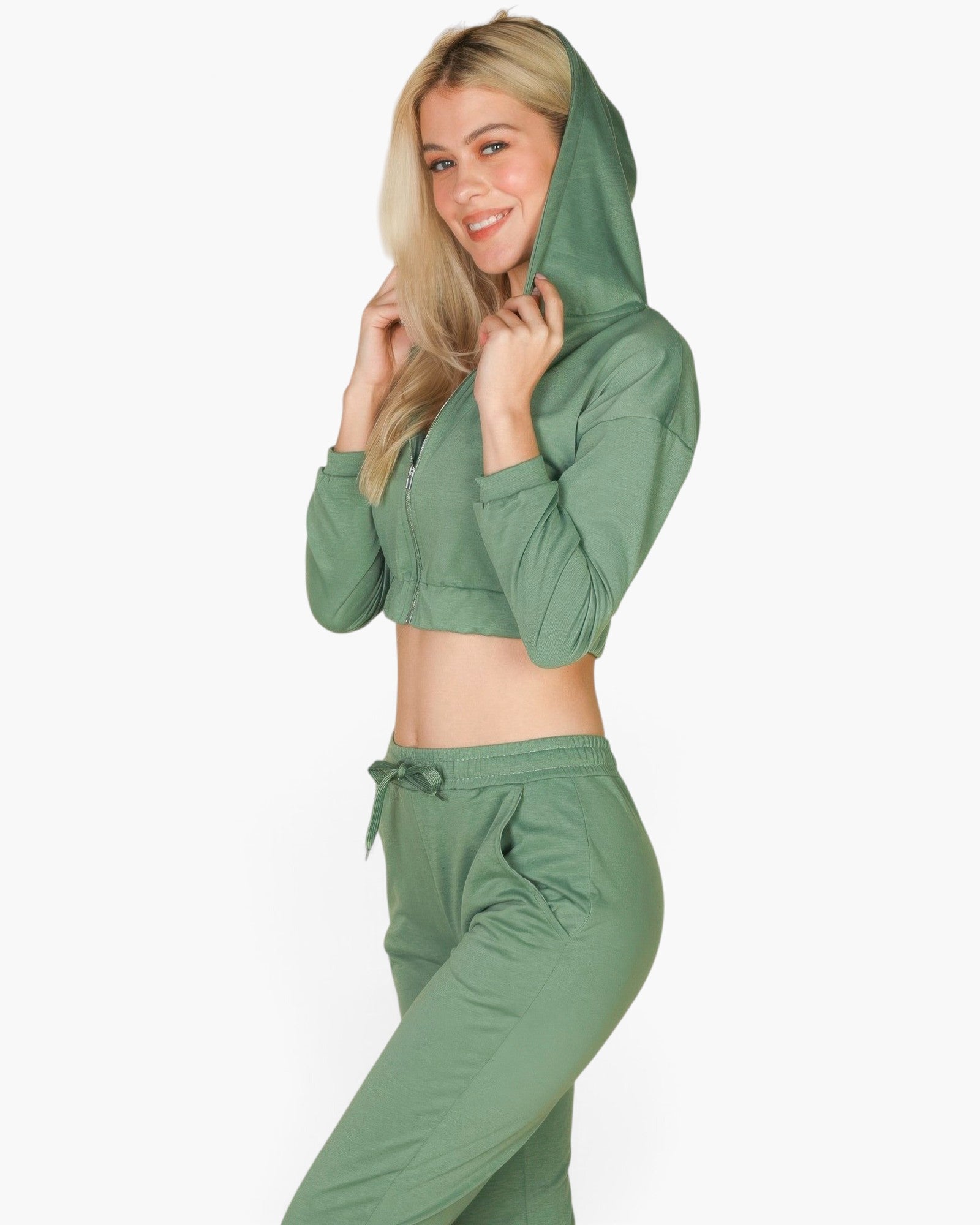 Beach Rose Co. green French terry zip-up cropped hoodie and matching joggers worn by a blonde woman