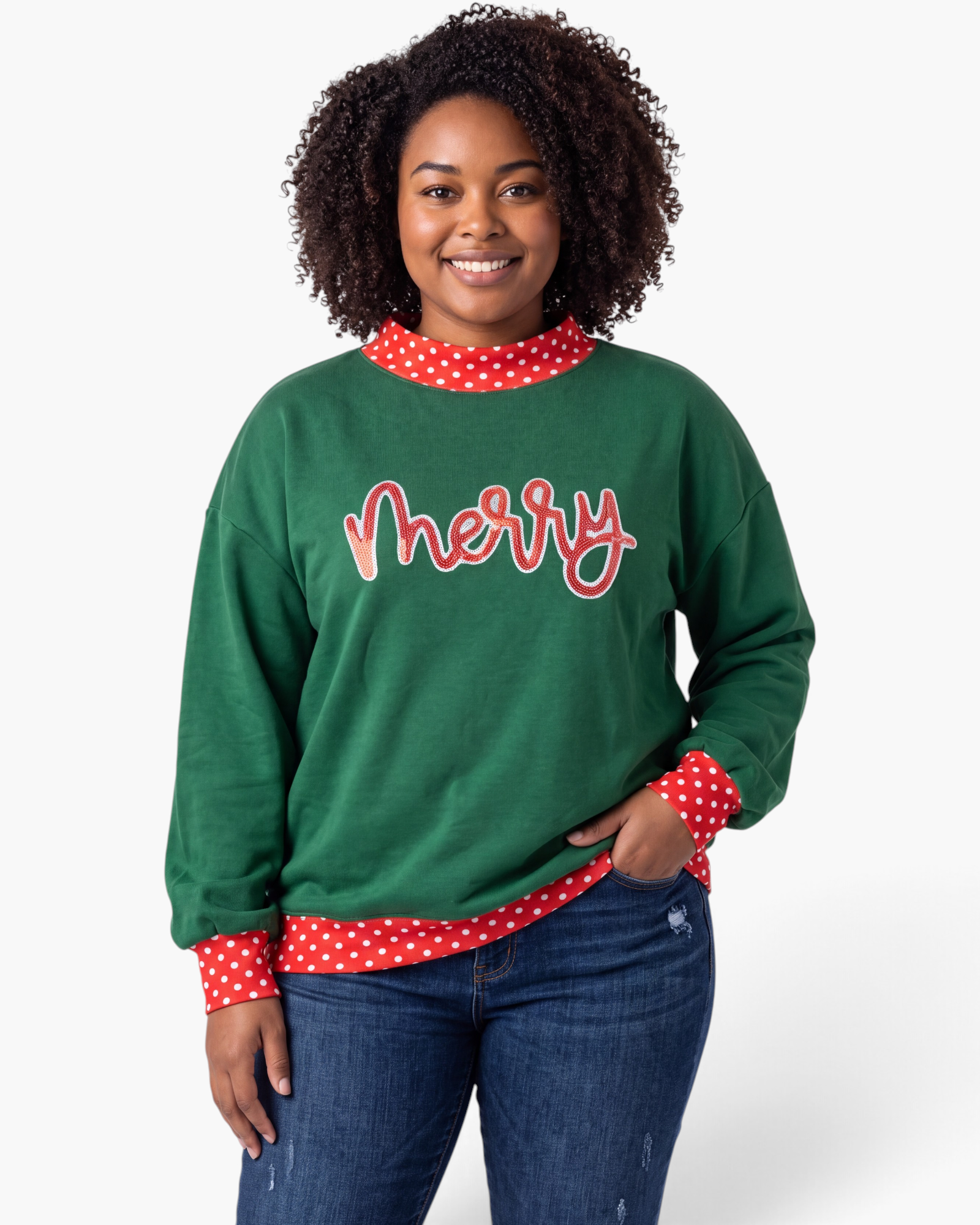 Beach Rose Co. green Christmas sweatshirt with red sequin merry lettering and polka dot trim on a smiling model