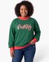 Beach Rose Co. green Christmas sweatshirt with red sequin merry lettering and polka dot trim on a smiling model