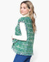 Beach Rose Co. green plaid tweed vest with frayed raw edges and front flap pockets worn over a white turtleneck.