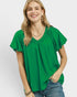 Beach Rose Co. green textured woven rayon-nylon blend blouse with ruffled V-neckline and puff sleeves.