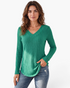 Beach Rose Co. green ribbed long sleeve V-neck knit top worn by a woman with blue jeans
