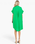 Back view of a Beach Rose Co. green shirt dress with ruffled sleeves, oversized fit, and curved hem on a model.