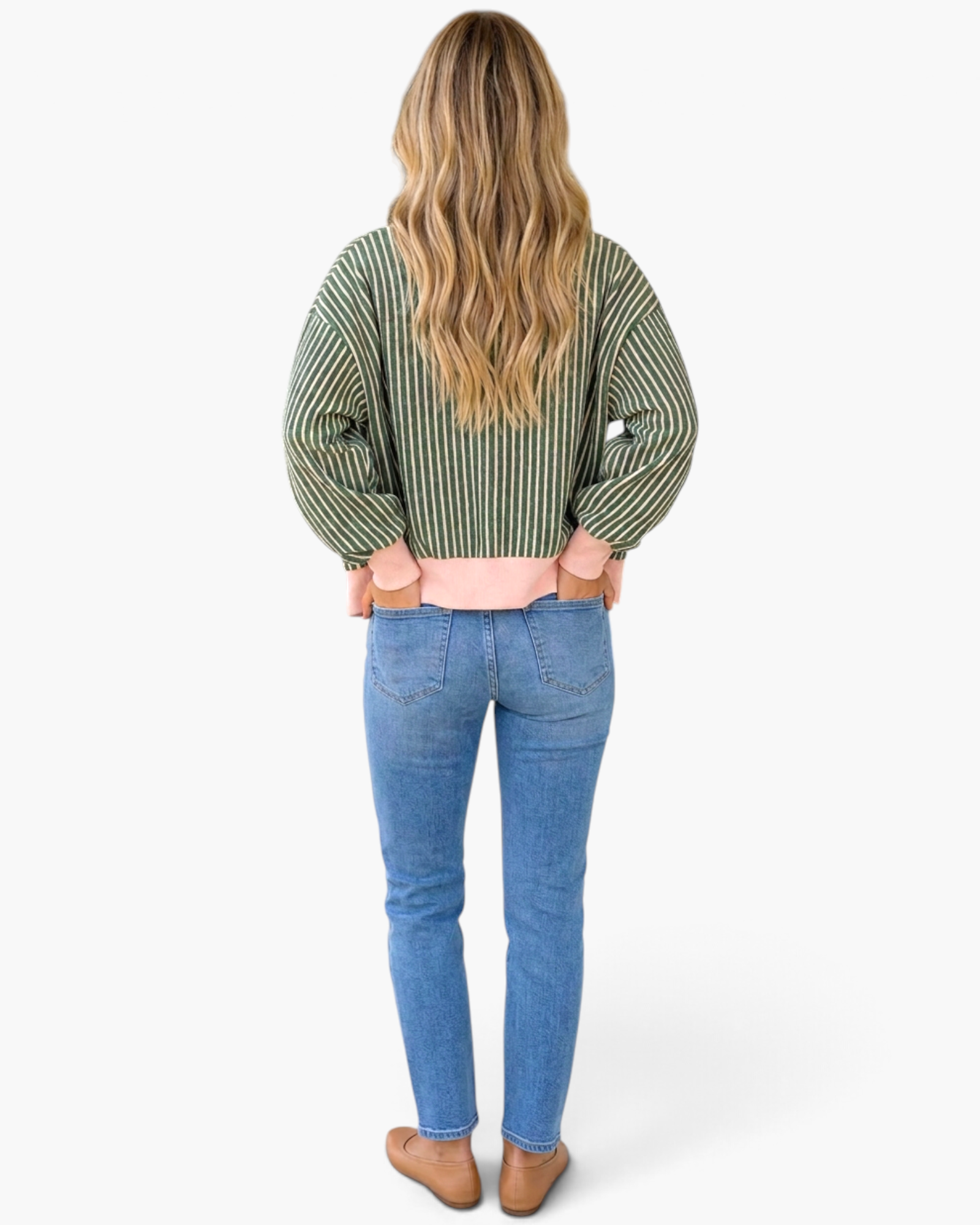 Beach Rose Co. green striped cardigan with pink hem, worn by a woman with long blonde hair, back view.