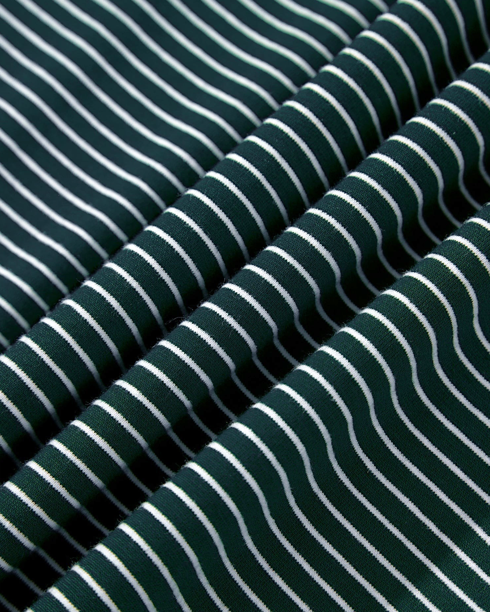 Beach Rose Co. green cotton blend fabric with fine white micro-stripes and soft draped folds