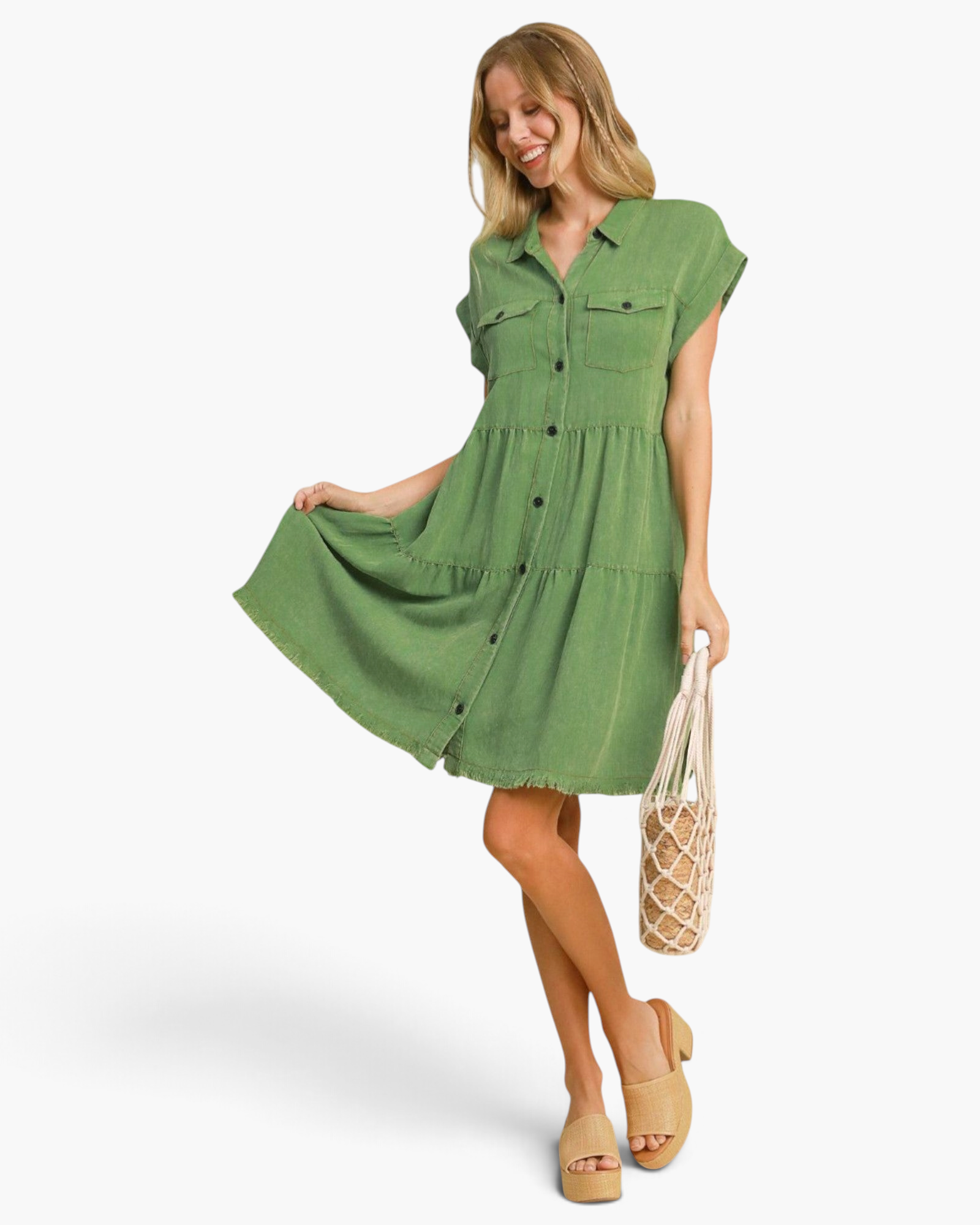 Beach Rose Co. green tiered shirt dress with button front, chest pockets, and frayed hem worn by a smiling model.