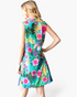 Beach Rose Co. green sleeveless swing dress with a vibrant tropical floral print and notched V-neckline