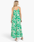 Back view of a Beach Rose Co. green and ivory tropical print maxi dress with adjustable straps on a blonde model.