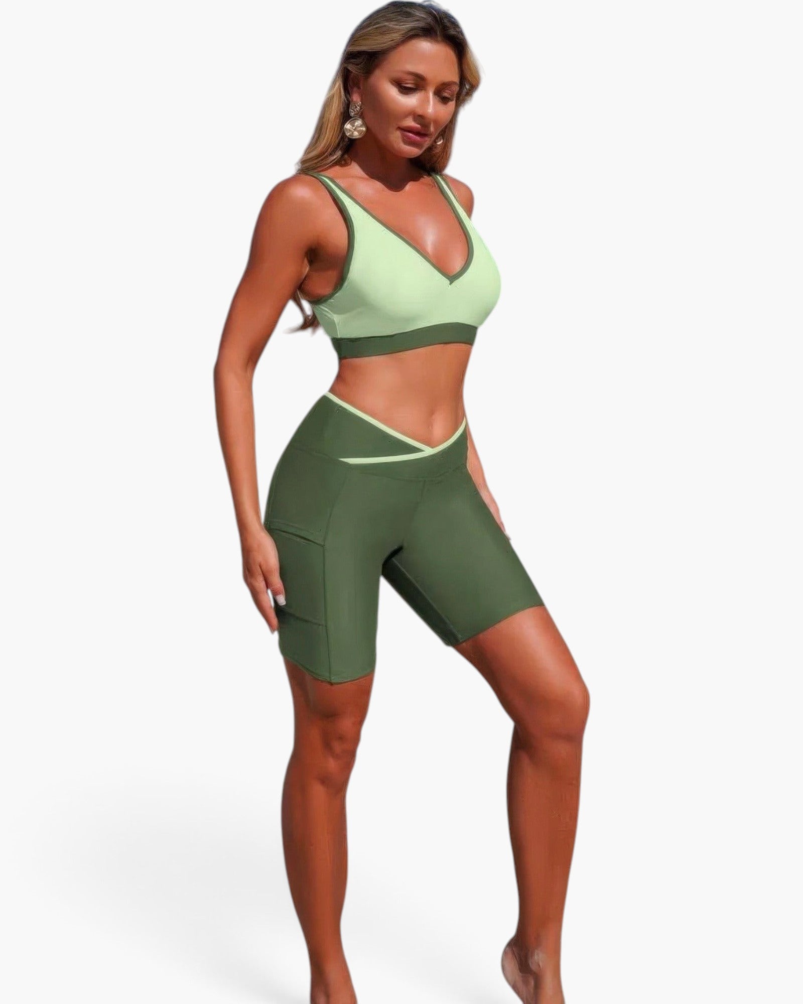 Beach Rose Co. two-piece yoga set with a light green sports bra and dark green high-waisted biker shorts.