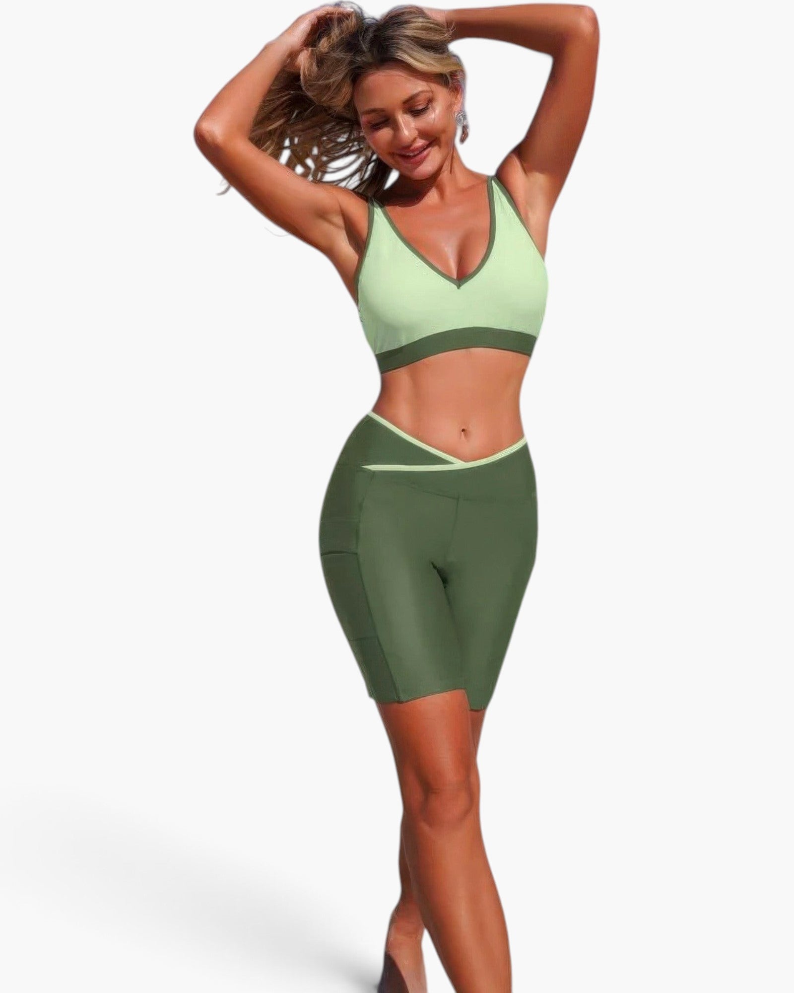Beach Rose Co. two-piece yoga set with a light green sports bra and dark green biker shorts in stretch fabric.