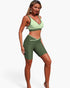 Beach Rose Co. two-piece yoga set with a light green sports bra and dark green high-waisted biker shorts.