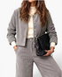 Beach Rose Co. grey corduroy two-piece set with a button-front jacket and wide-leg pants worn with a cream top.