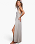 Beach Rose Co. grey racerback maxi dress with pleated skirt, scalloped trim, and side slits worn by a model