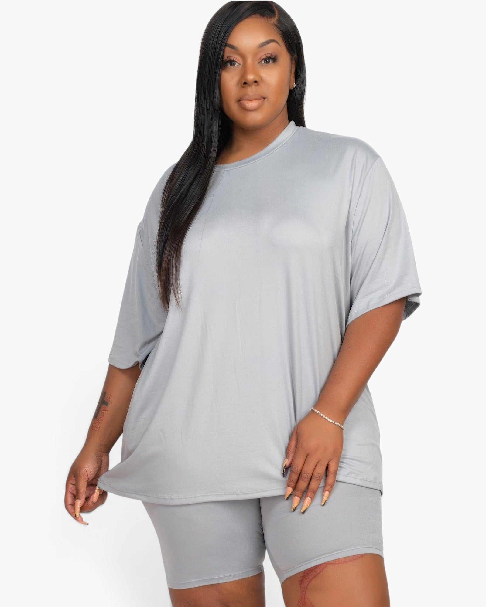 Beach Rose Co. plus size model wearing a grey loose fit jersey top and matching biker shorts set.