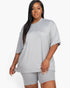 Beach Rose Co. plus size model wearing a grey loose fit jersey top and matching biker shorts set.