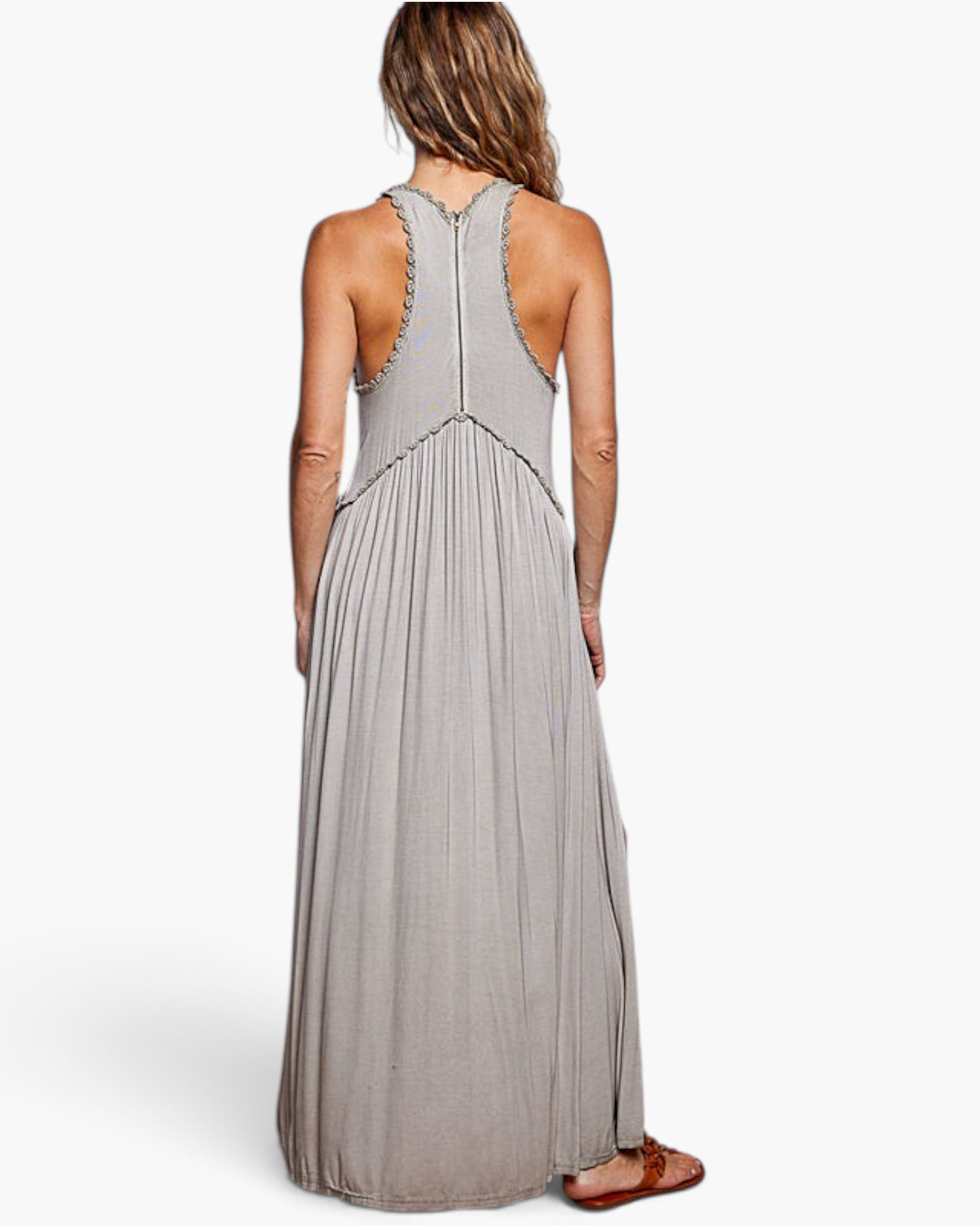 Beach Rose Co. grey maxi dress with a racerback bodice, pleated skirt, and scalloped trim, viewed from the back.