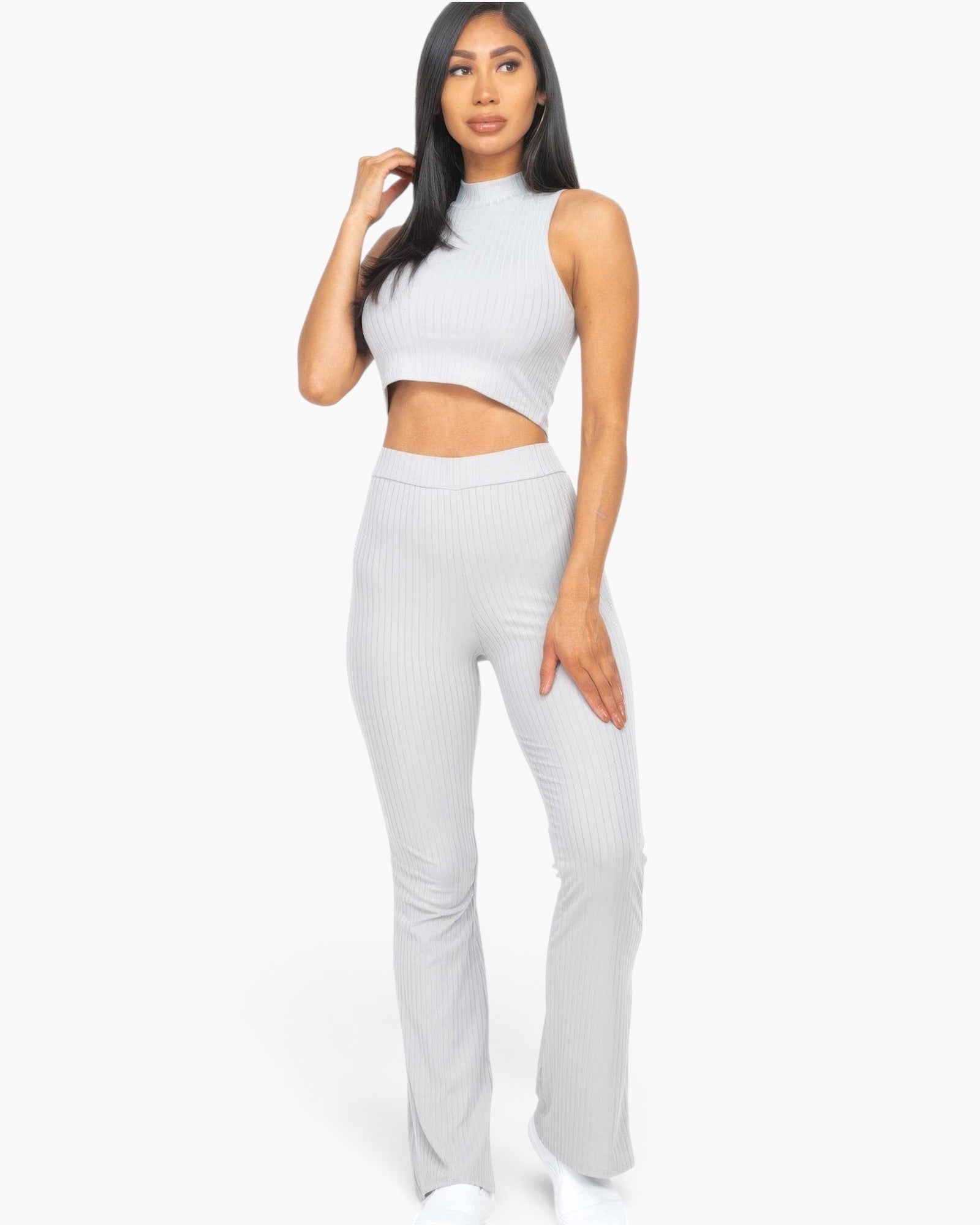 Beach Rose Co. grey ribbed mock neck crop tank top and matching bootcut pants worn by a woman on a white background.