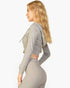 Beach Rose Co. grey ribbed crop zip hoodie worn by a blonde woman in a side profile view against a white background