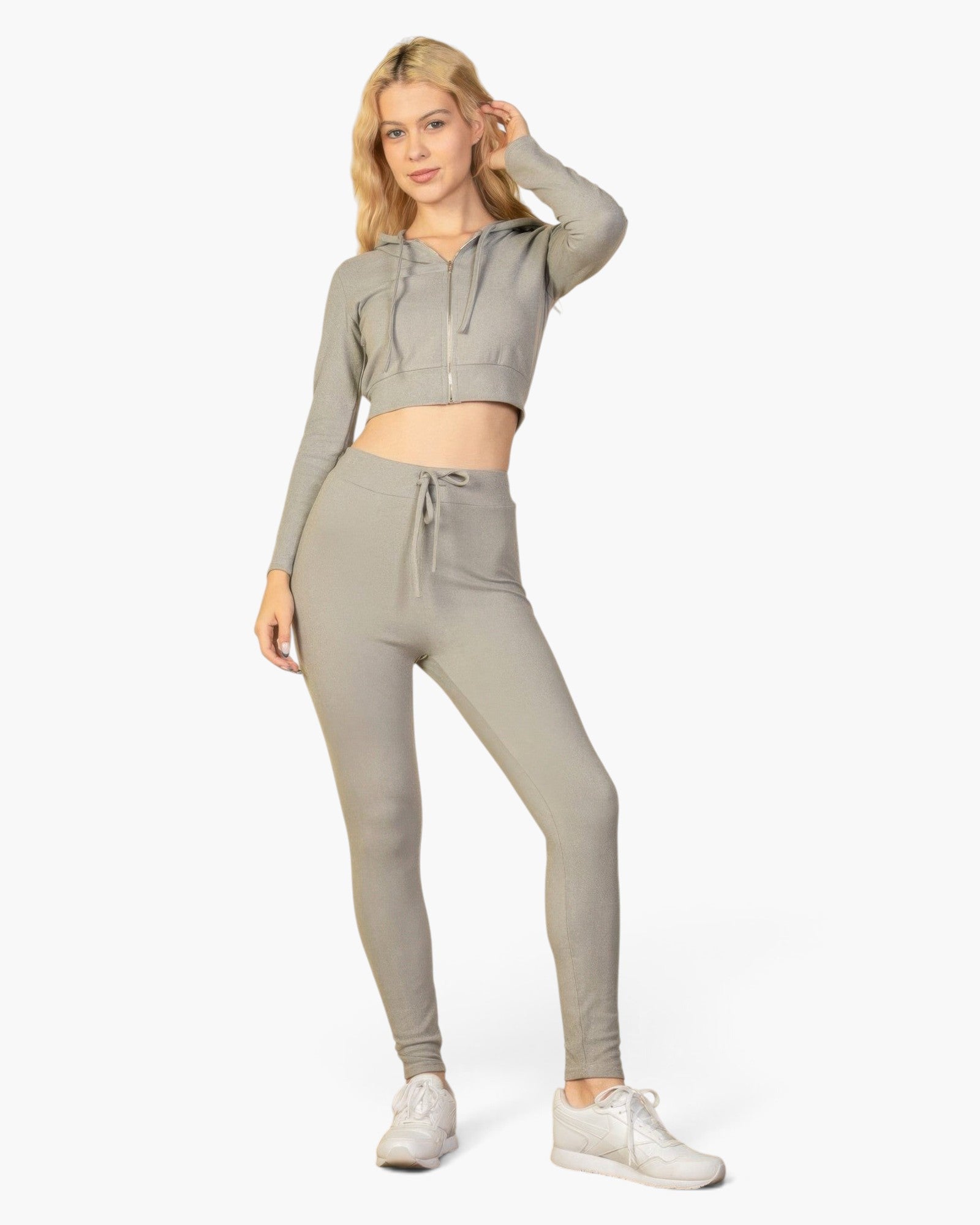 Beach Rose Co. model wearing grey ribbed tie-front lounge leggings and a matching cropped zip-up hoodie