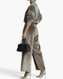 Beach Rose Co. grey velvet matching set with a mock neck top and pleated wide leg pants, styled with heels and a bag.