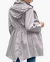 Beach Rose Co. grey waterproof hooded rain jacket with a gathered waist, flap pockets, and a back vent.