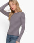 Beach Rose Co. grey and white striped long sleeve crew neck sweater worn by a blonde woman with blue jeans.