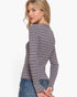 Beach Rose Co. grey and white striped long sleeve crew neck sweater worn by a blonde woman against a white background.
