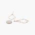 Beach Rose Co. gold-tone kite-shaped earrings with a hammered texture, shown next to a coin for size reference.