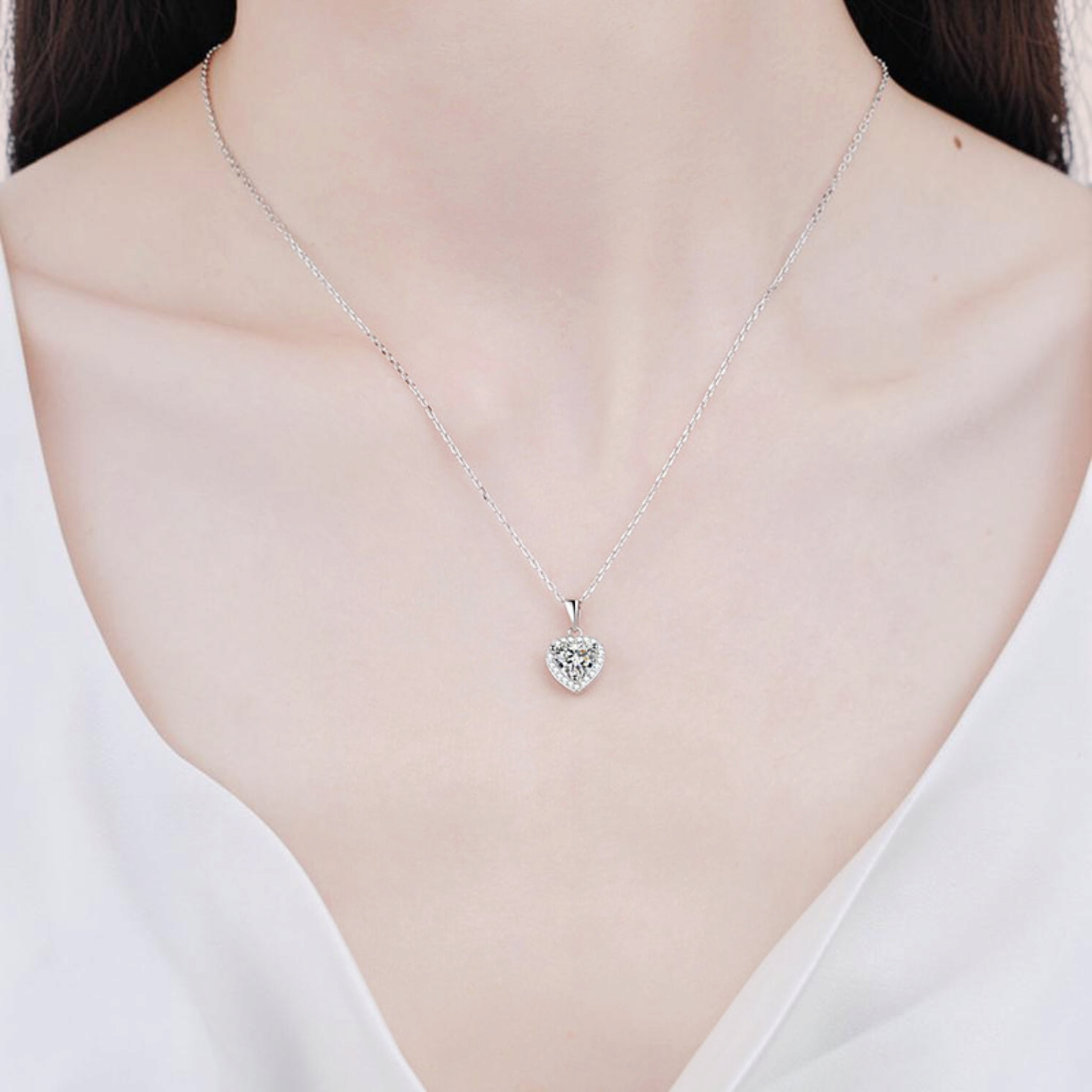 Beach Rose Co. silver heart-shaped moissanite pendant necklace with a zircon halo on a delicate sterling silver chain.
