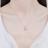 Beach Rose Co. silver heart-shaped moissanite pendant necklace with a zircon halo on a delicate sterling silver chain.