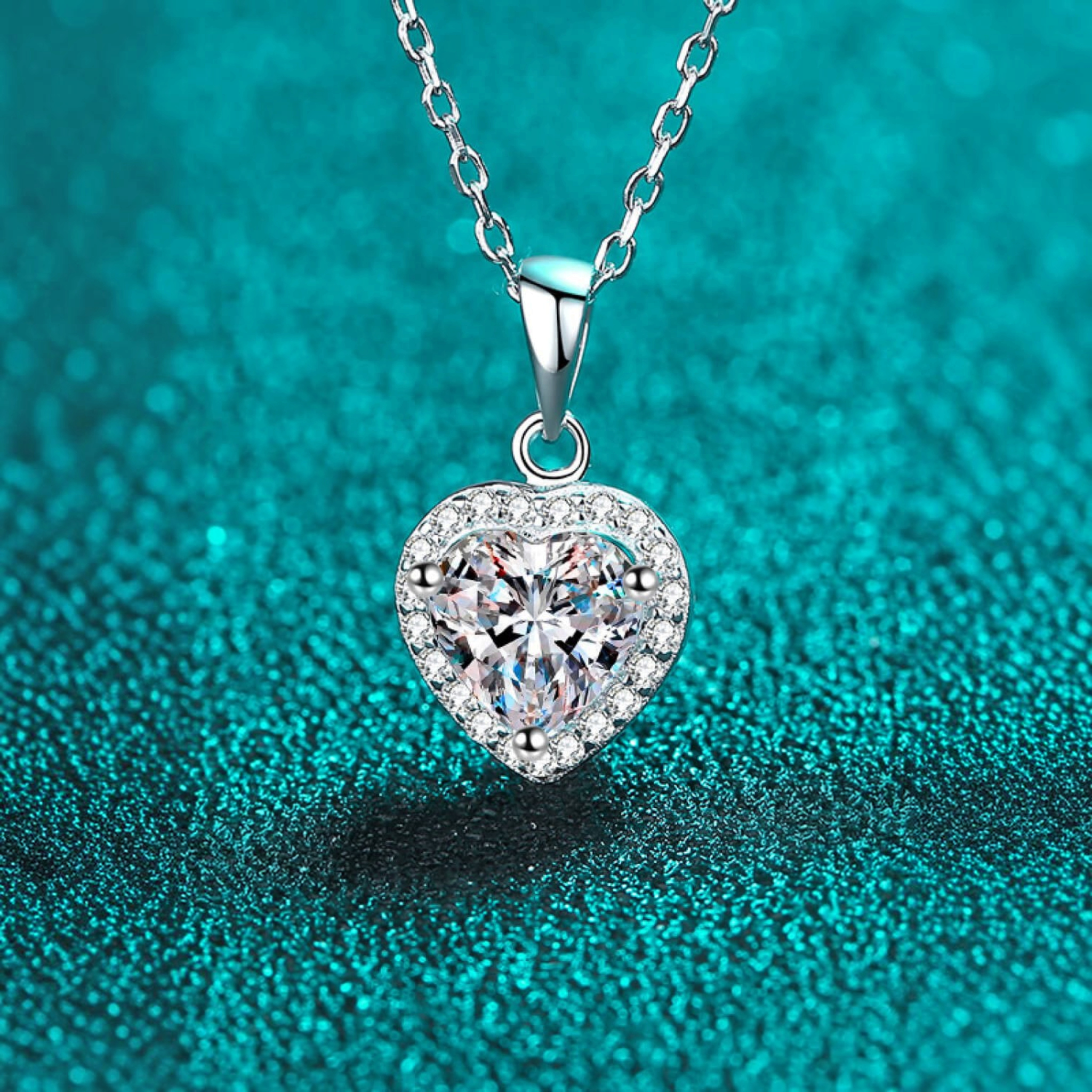 Beach Rose Co. silver heart-shaped moissanite pendant necklace with a zircon halo on a delicate link chain.