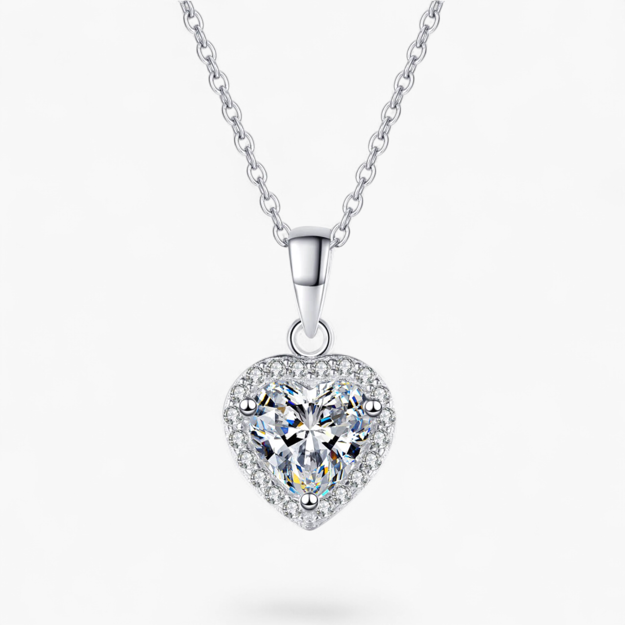 Beach Rose Co. silver heart-shaped moissanite pendant necklace with a zircon halo on a delicate sterling silver chain.