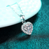 Beach Rose Co. silver heart-shaped moissanite pendant necklace with a zircon halo on a delicate link chain.