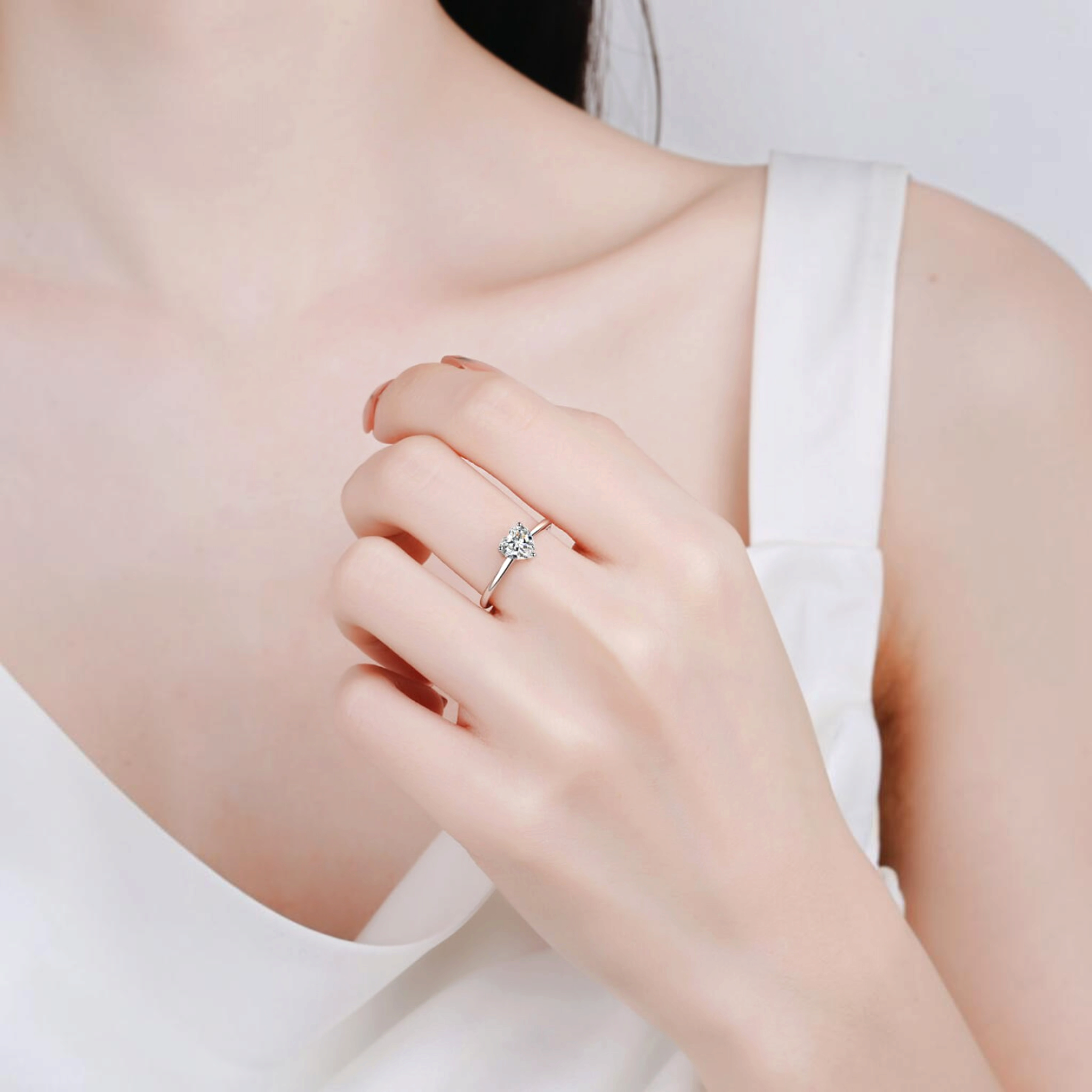 Beach Rose Co. sterling silver ring featuring a heart-shaped moissanite solitaire on a slim polished band.