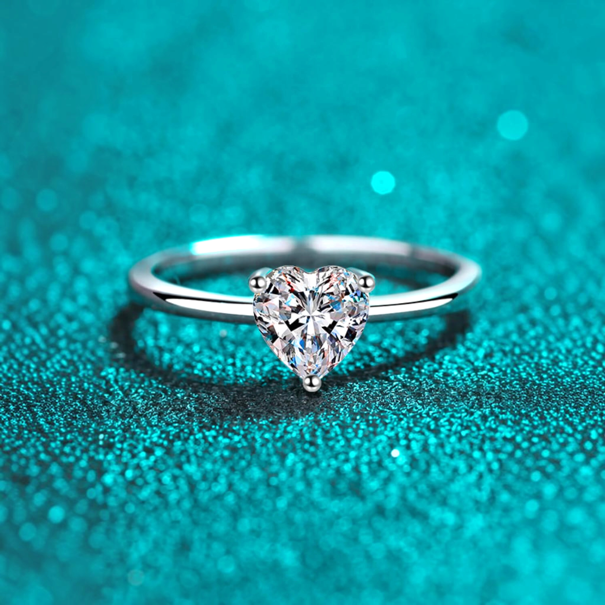 Beach Rose Co. sterling silver ring featuring a heart-shaped moissanite solitaire on a slim polished band.