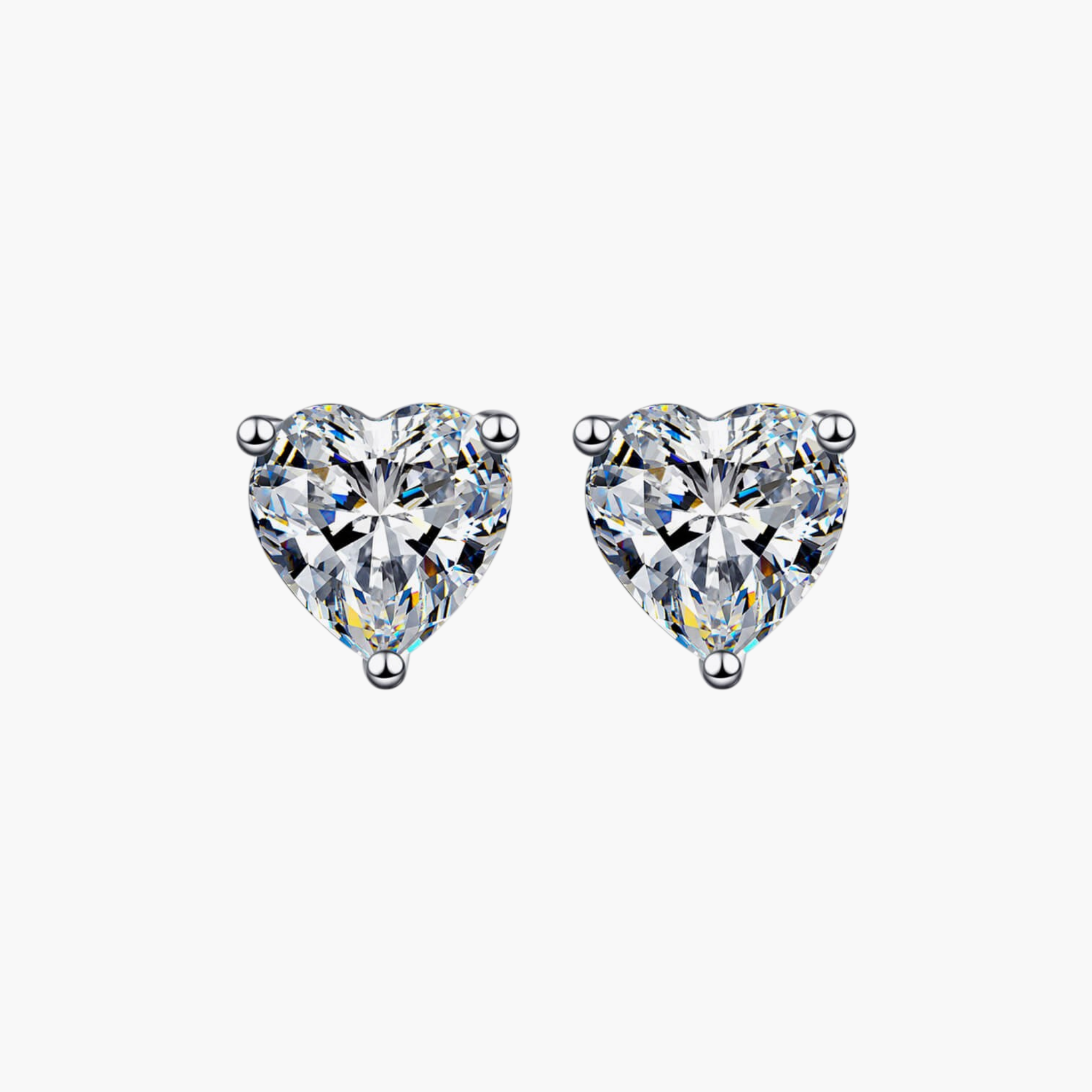 Beach Rose Co. heart-shaped moissanite stud earrings in rhodium-plated sterling silver with three-prong settings.