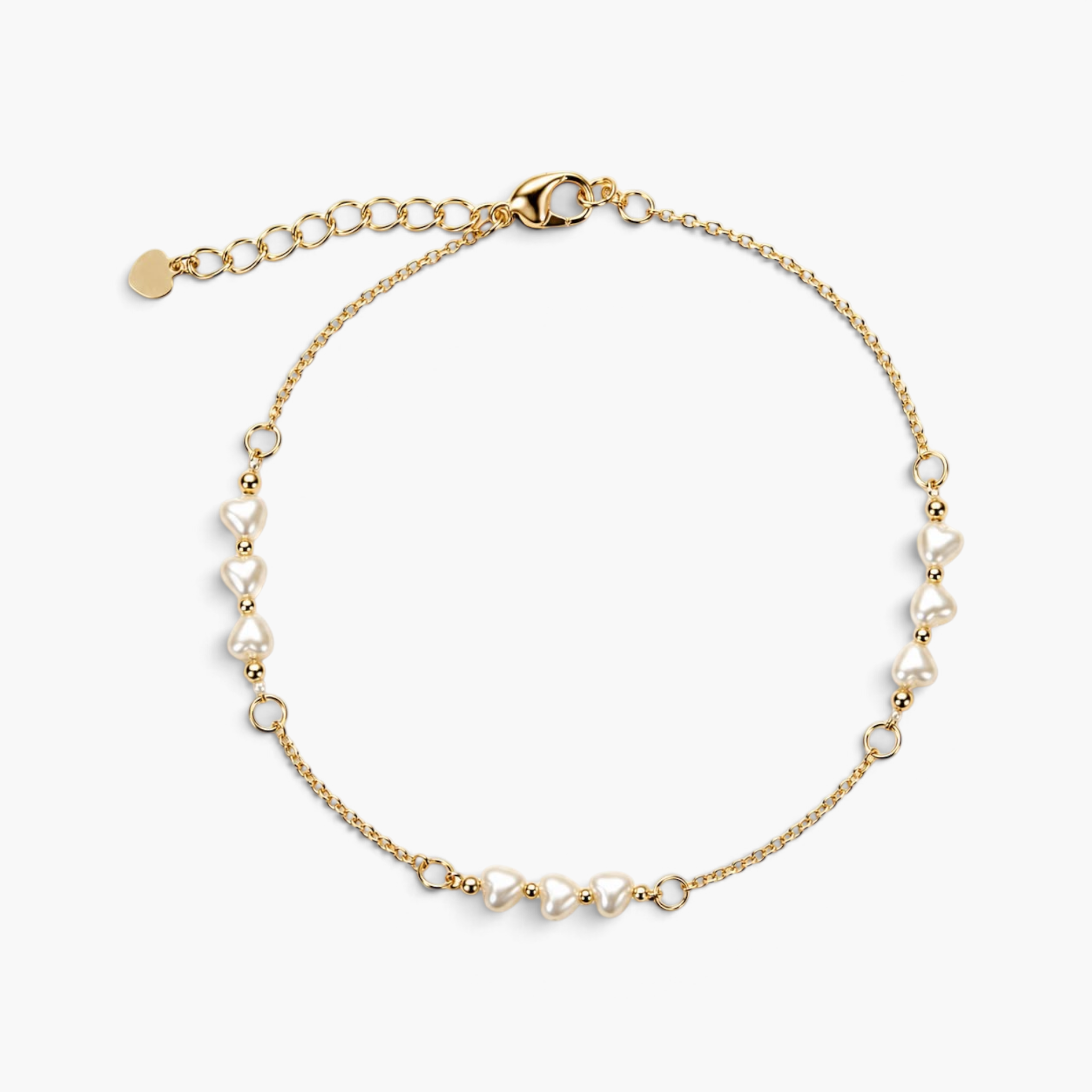 Beach Rose Co. gold chain bracelet featuring delicate heart-shaped pearl beads and a lobster clasp with an extender.