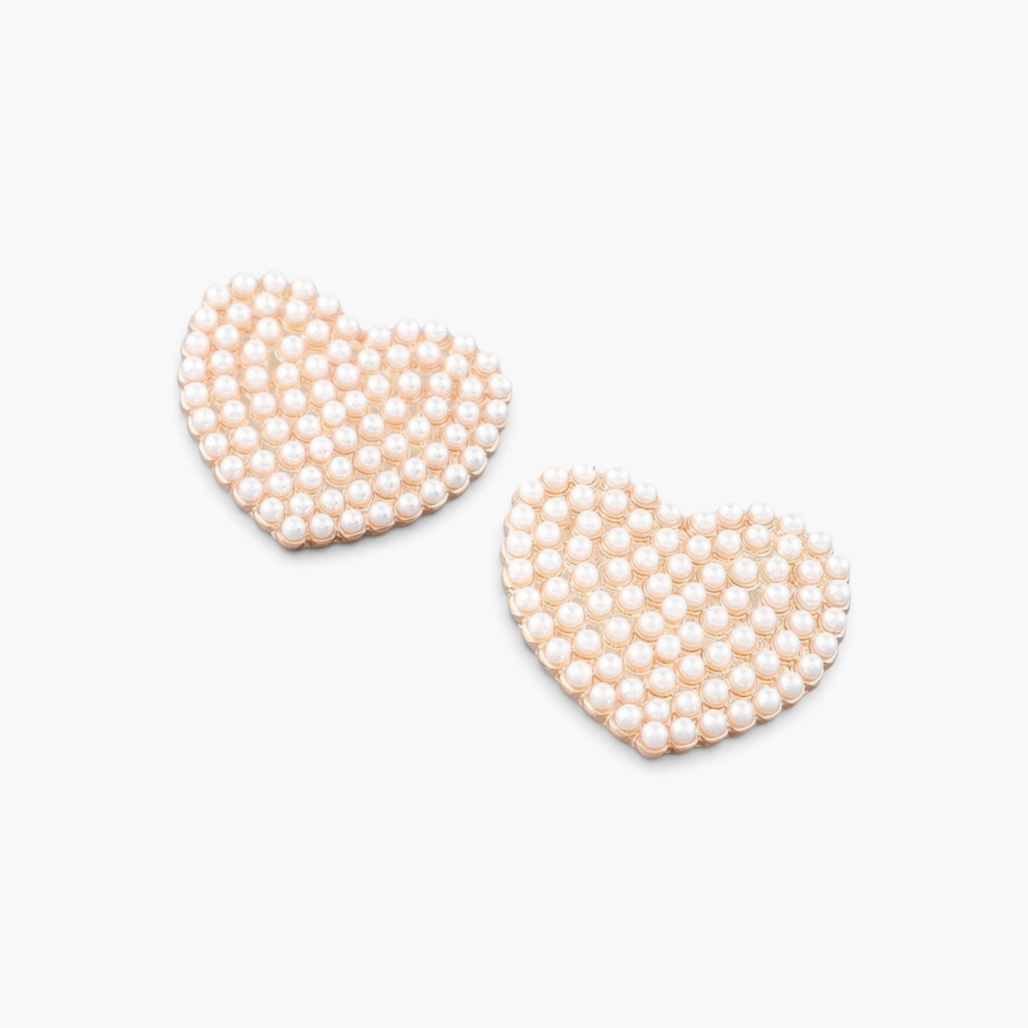 Beach Rose Co. heart-shaped stud earrings featuring delicate cream pearls set on gold-plated metal.