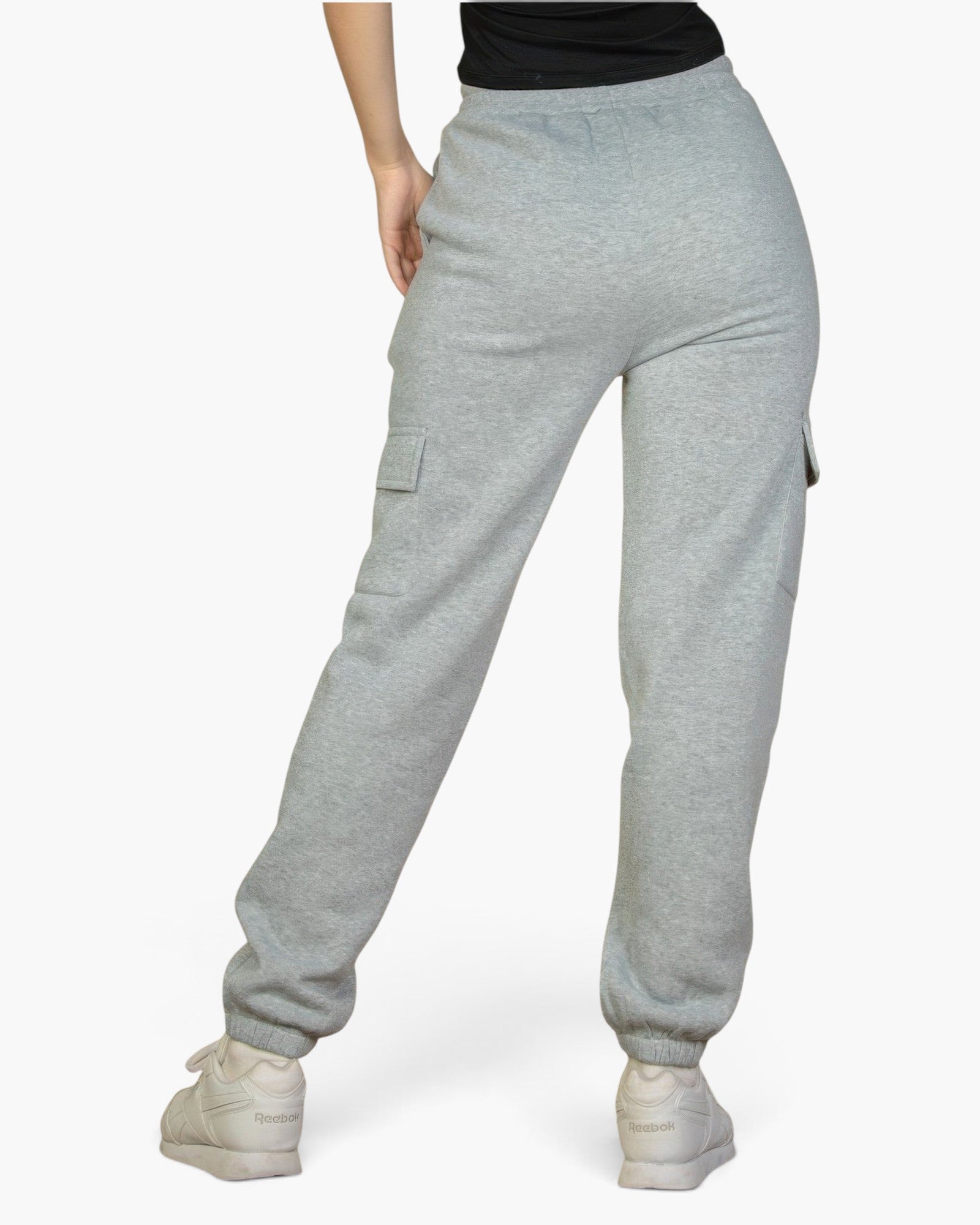 Beach Rose Co. heather gray sweatpants with side pockets and drawstring waist worn by a woman from the back view