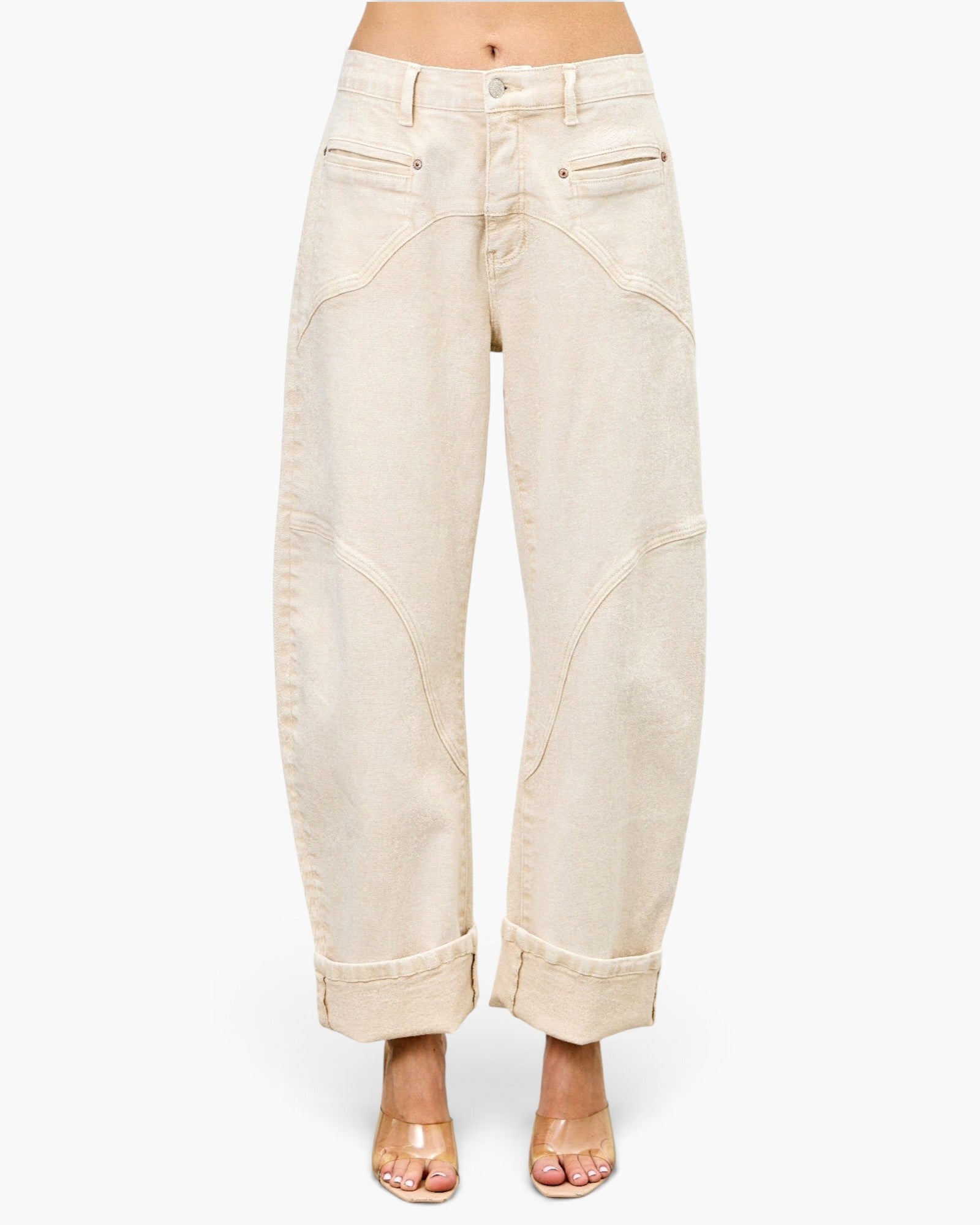 Beach Rose Co. high-rise barrel-leg jeans in a neutral beige tone with western-inspired curved seam detailing.