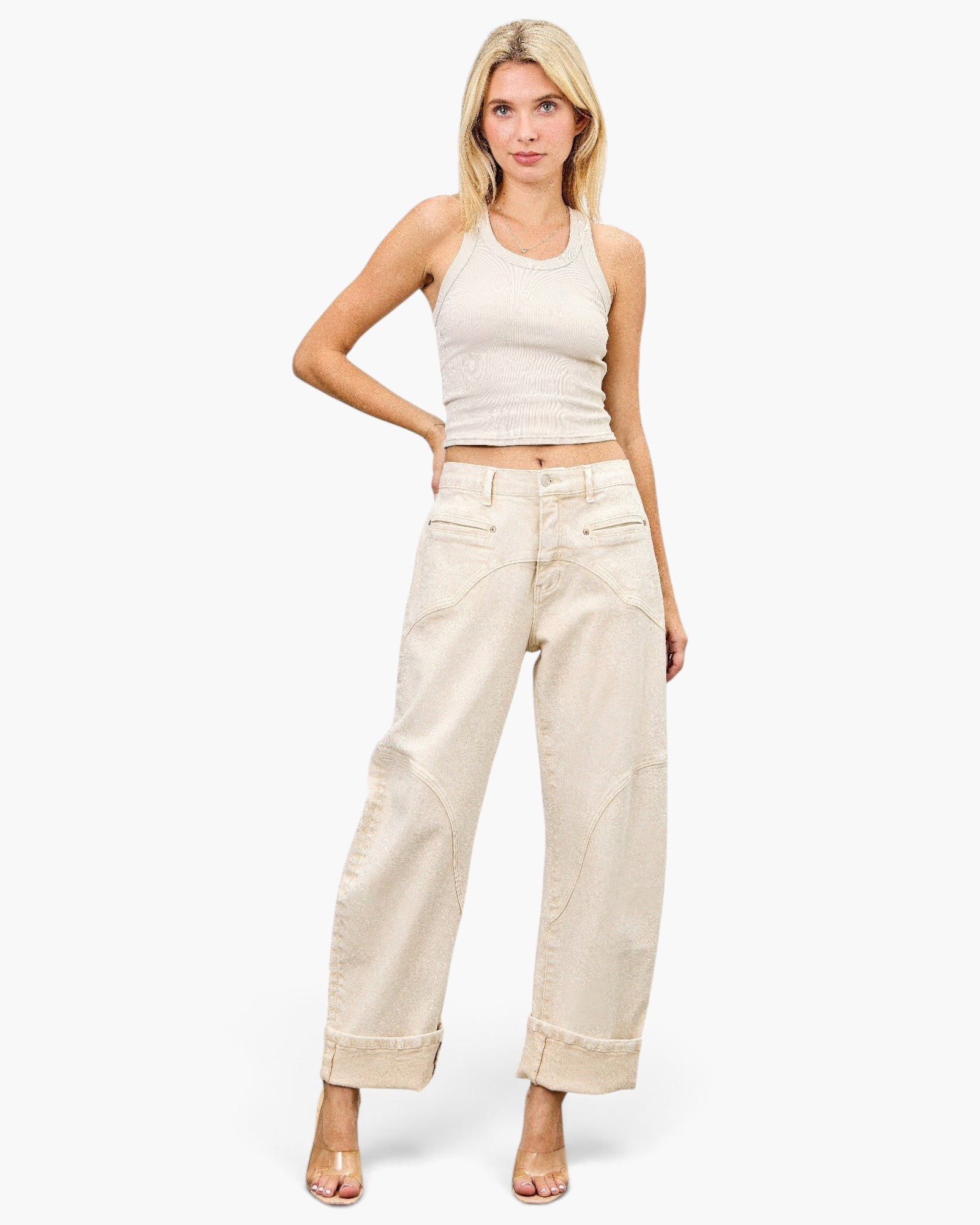 Beach Rose Co. high-rise barrel-leg jeans in a neutral cream shade with western-inspired stitching on a model