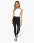 Beach Rose Co. model wearing high rise black skinny jeans with tummy control and a white sleeveless top