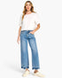 Beach Rose Co. high-rise wide-leg cropped jeans with a released hem and tummy control, worn with a white t-shirt.